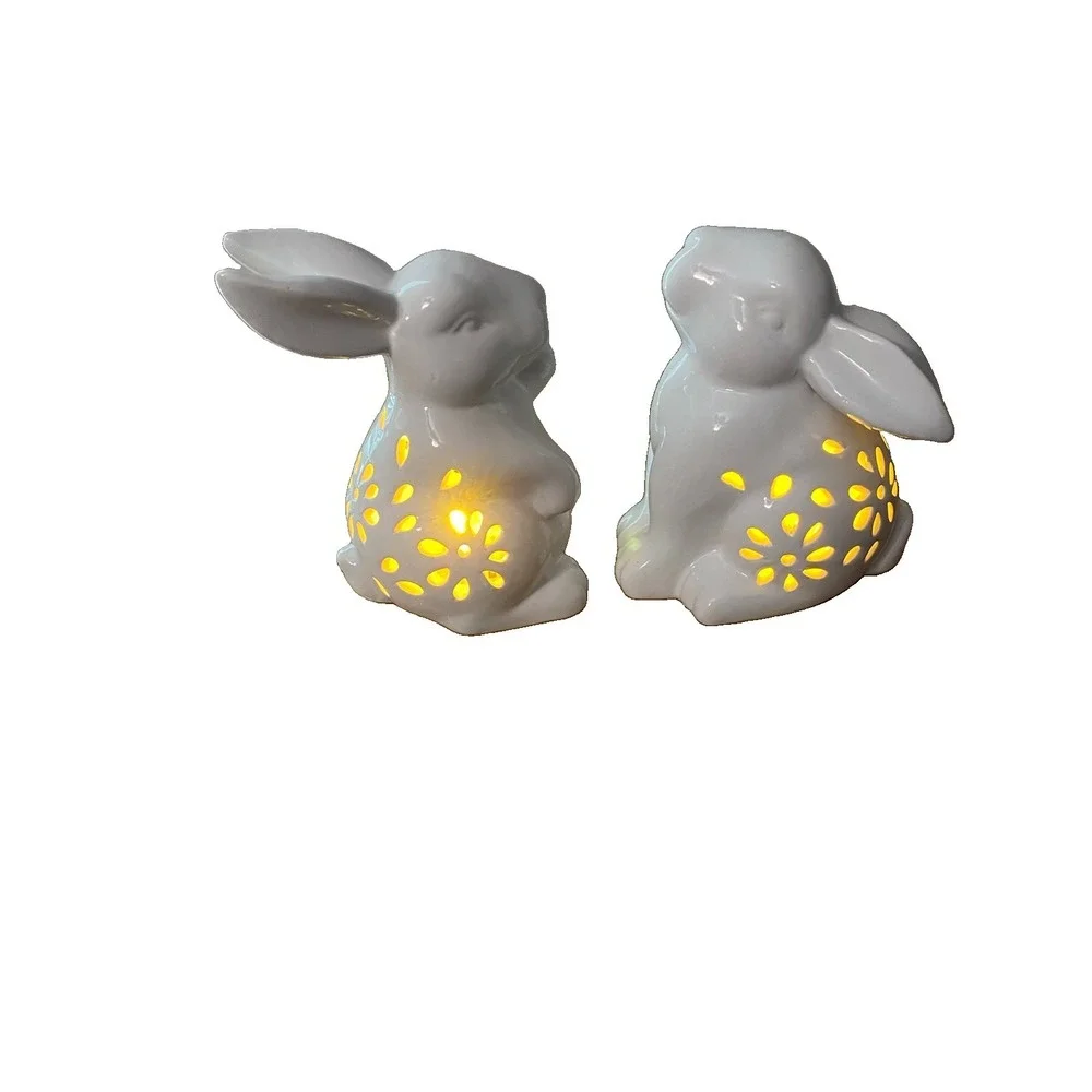 White Ceramic Rabbits Animal Figurine with Cutout Floral Pattern. Lighted.